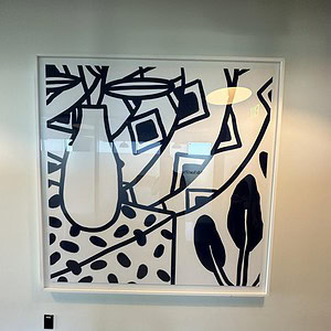 Geometric black and white vase artwork, modern wall decor, abstract design, minimalistic art piece.