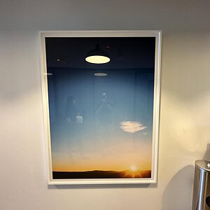 Sunrise over mountain top framed art, capturing a serene landscape scene.