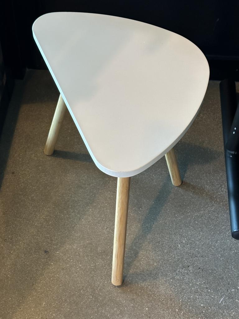 White triangle kidney table with wood legs