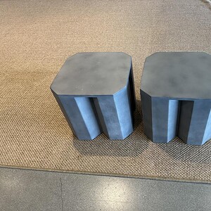 Elegant stone finished plaster tables for stylish interior design.