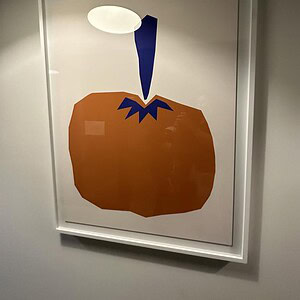 Pop art of an orange pear with a blue stem and stylized design.