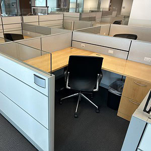 Modern Allsteel 6x6 office workstation with glass partitions and ergonomic chair.