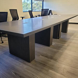 Modern 12ft Asian Night conference table with black base and light wood top.