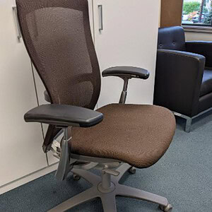 Fully loaded Knoll Life office chair with chocolate brown mesh upholstery. Ergonomic design for comf.