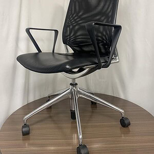 Vitra Meda mesh back office chair with chrome base, ergonomic design, and adjustable features. Perfe.