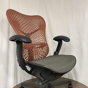 Herman Miller Mirra 2 ergonomic office chair with breathable mesh back and adjustable features.