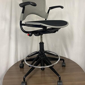 Herman Miller Caper stool with adjustable height and ergonomic design for office comfort.
