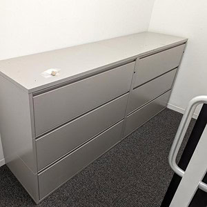 Modern 42-inch wide three drawer lateral filing cabinet for office storage.