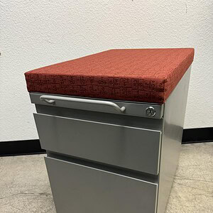 Office pedestal with red cushion for Herman Miller furniture.