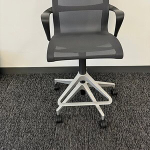 Herman Miller Setu ergonomic office chair with mesh back and adjustable height.