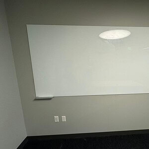 Modern glass whiteboard for offices and classrooms. Sleek, durable, and easy to clean. Perfect for p.