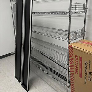 Heavy-duty wire rack shelving unit for industrial and commercial storage solutions.