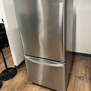 Stainless Whirlpool fridge model WRB322DMBM00 with modern design and spacious interior.