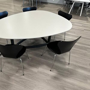 Exclave table with black and white finish, ideal for collaborative workspaces and meetings.