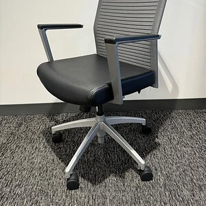 High back black leather & mesh office chair for ergonomic comfort.