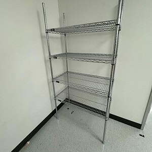Chrome wire shelving rack with four adjustable shelves for versatile storage solutions.