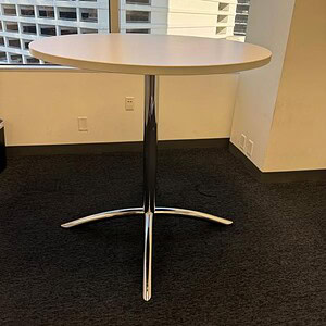 Herman Miller Eames 42-inch round white bar table, modern design, perfect for commercial or home use.