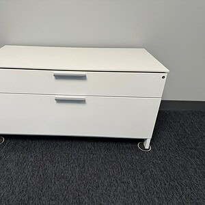 Credenza with 2 drawers, Herman Miller office furniture, modern white storage unit.