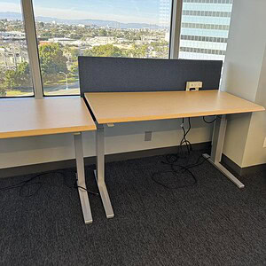 Herman Miller electric HAT table, 58x29 inches, ideal for modern office spaces and ergonomic worksta.
