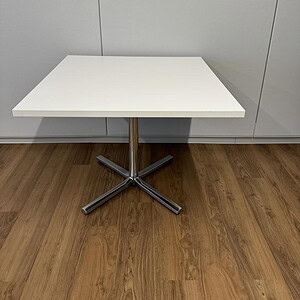 Herman Miller chrome 3x3ft white table, ideal for modern office or conference rooms. Durable design.