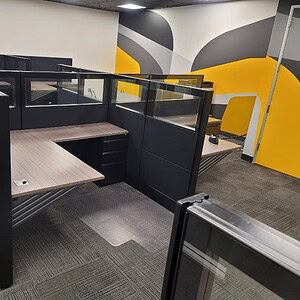 Modern Jet Black Ethospace 6x5 office cubicle with glass panels and workspace.
