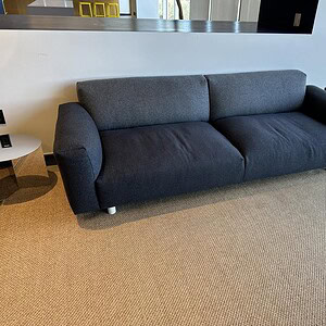 Oversized grey commercial sofa for modern office or lounge spaces. Durable, stylish, and comfortable.