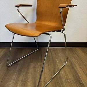 Century modern wooden chair with sleek design and metal legs. Perfect for stylish home or office dec.