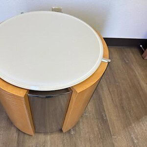 Modern glass top veneer side table with curved wooden legs for living room decor.
