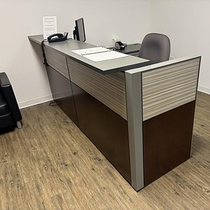 Modern Knoll 42-inch tall reception desk with hi-lo design in neutral tones.