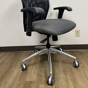 Ergonomic office chair with black mesh back and chrome base for comfort and style.