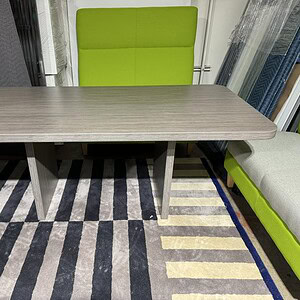 OFS 6x3 Driftwood racetrack conference table in modern office setting.