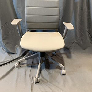 Modern gray task chair with adjustable armrests and rolling casters.