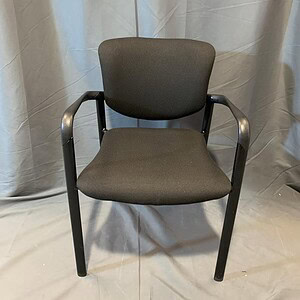 Haworth stacking chair with black frame and fabric seat for office or conference room.
