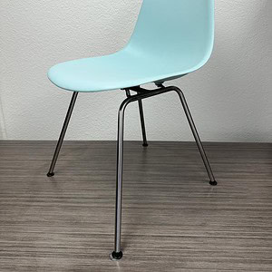 Eames Molded Plastic Chair in Grey Green, authentic design, perfect for modern interiors.