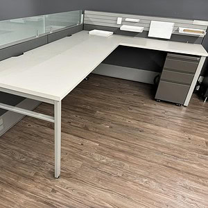 Haworth Compose 42-inch office desk with glass partition, ideal for professional workspaces and mode.