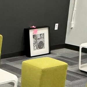 Lime green square ottoman in modern interior setting.
