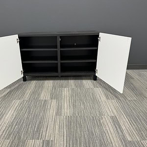 Modern white 4ft credenza with ample storage and adjustable shelves.