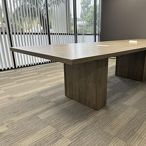 Haworth Driftwood Trapezoid Power Table in office setting.