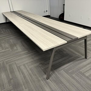 Modern Haworth Blonde 18x4ft powered benching table for office spaces.