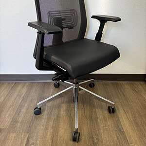 Ergonomic black leather Haworth office chair with adjustable armrests and mesh back for comfort and.