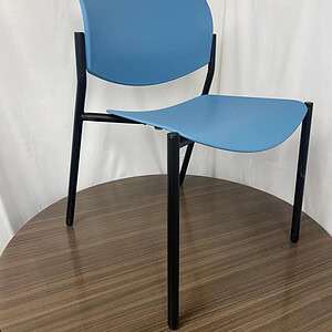 Blue stacking chair for office or home seating, lightweight and durable, perfect for versatile use.