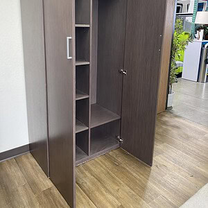 Modern driftwood storage wardrobe with multiple shelves and hanging space.