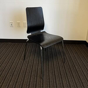 Black Gilbert chair by Ikea, ideal for contemporary office or home workspace. Sleek design with dura.