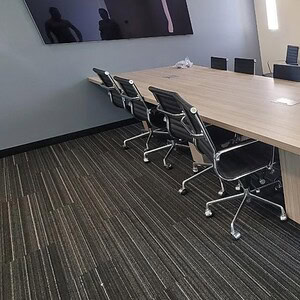 Haworth Veranda Trapezoid Power conference table in modern office setting.