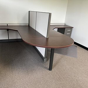 Office desk with Herman Miller A02 6x6 configuration, 53/31 inches, in a professional workspace.
