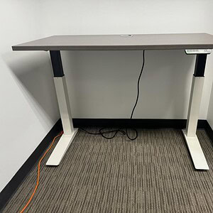 Adjustable Driftwood Desk by Haworth, perfect for ergonomic workspaces and modern office setups.