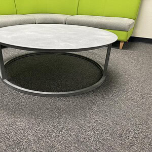 Metal 49-inch round coffee table with stone finish, modern design for living rooms.