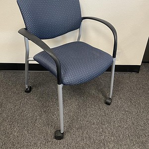 Blue Stackable Office Chair with Casters for Versatile Seating.