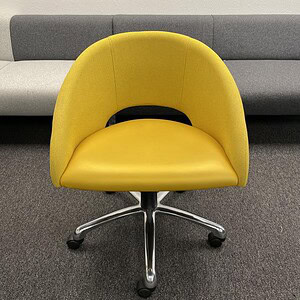 Bright yellow office chair with chrome base and casters, modern ergonomic design.