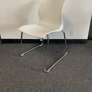 White stackable steel base chair for modern office and conference room settings. Durable, sleek desi.